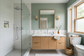 AI-generated bathroom inspiration with muted sage-green painted walls