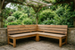 AI-generated exterior timber seating inspiration, not a verified Unica application or protection demonstration